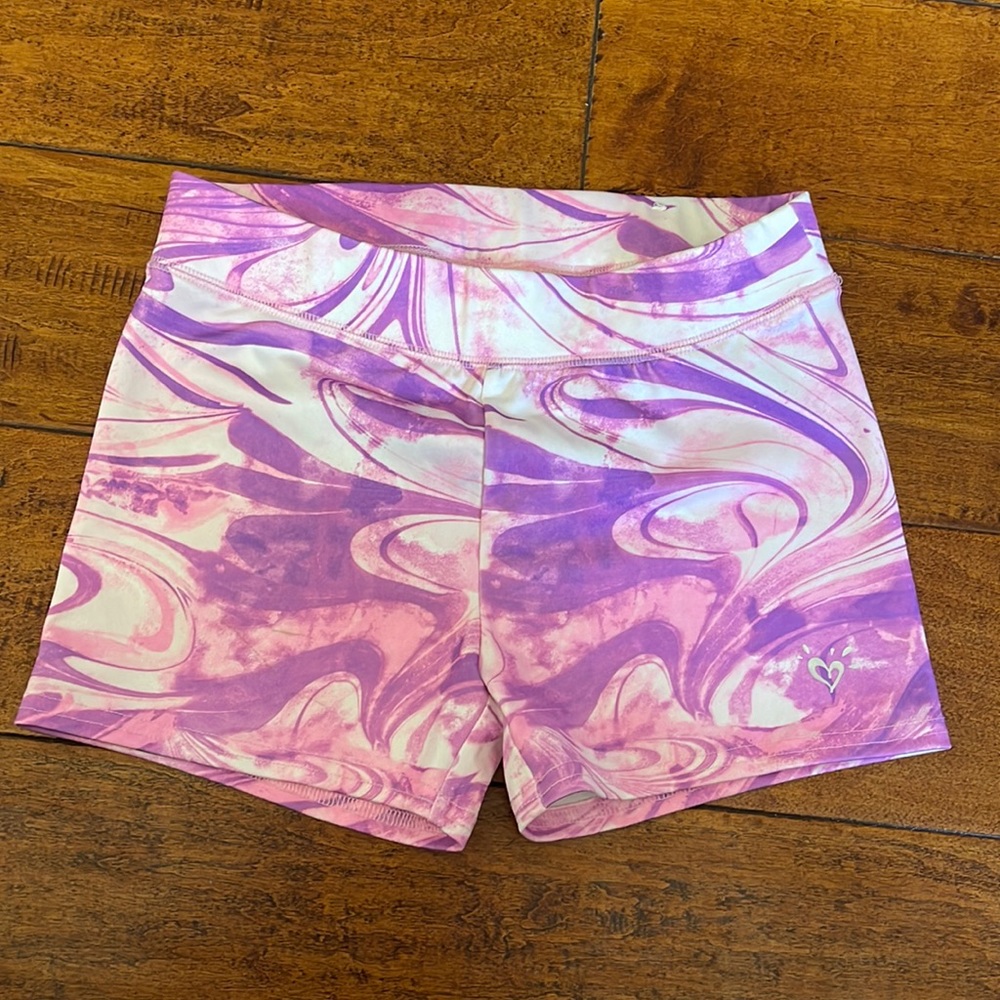 Justice size 10 dance shorts. Color light pinks and lavender. Perfect condition